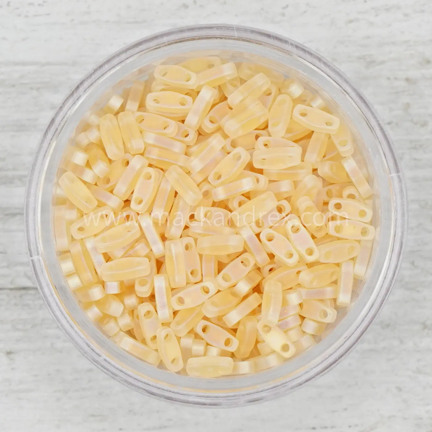 a bowl filled with lots of yellow pasta