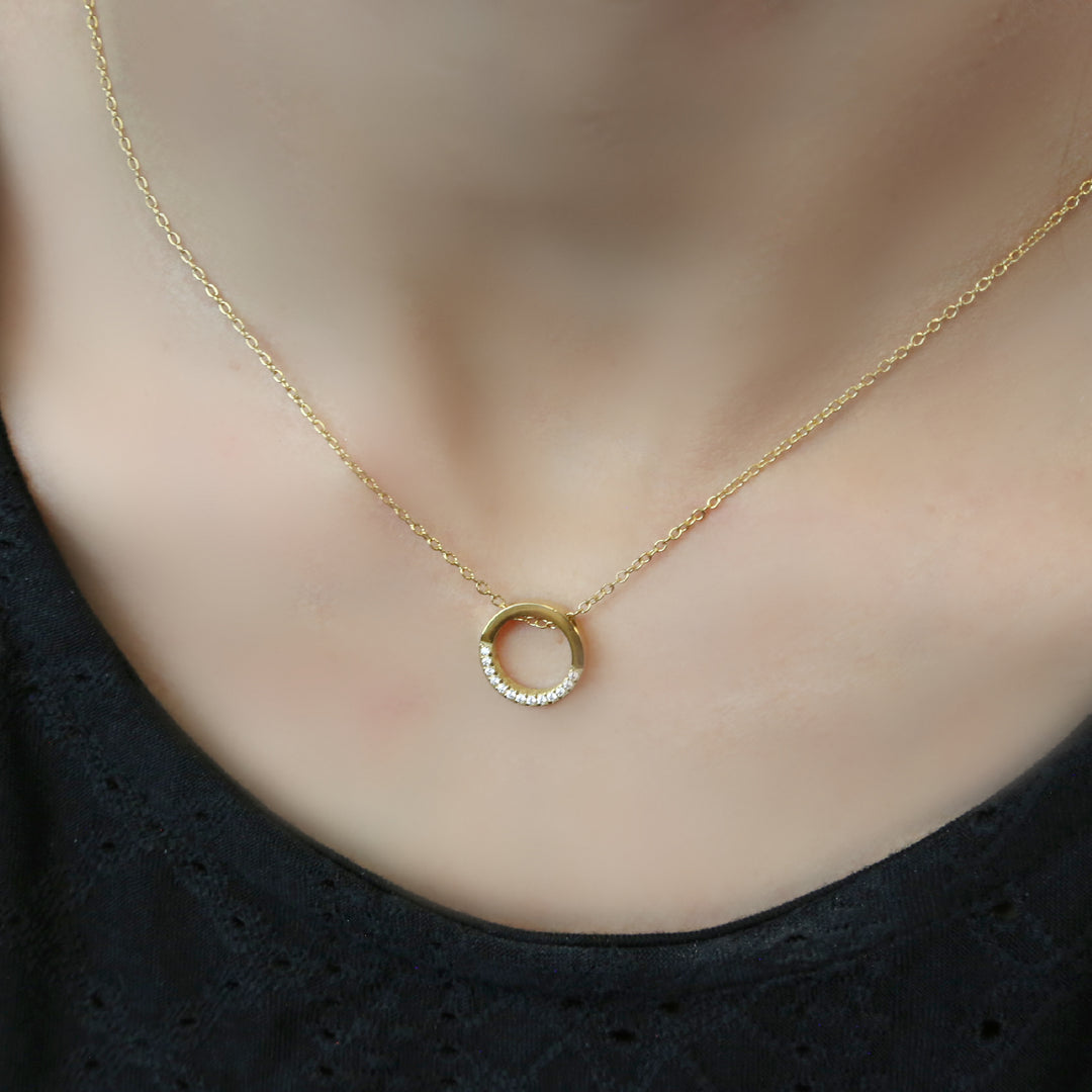 a close up of a person wearing a necklace