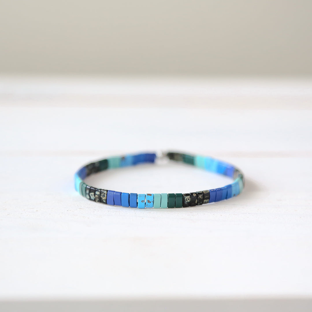 a close up of a bracelet on a table