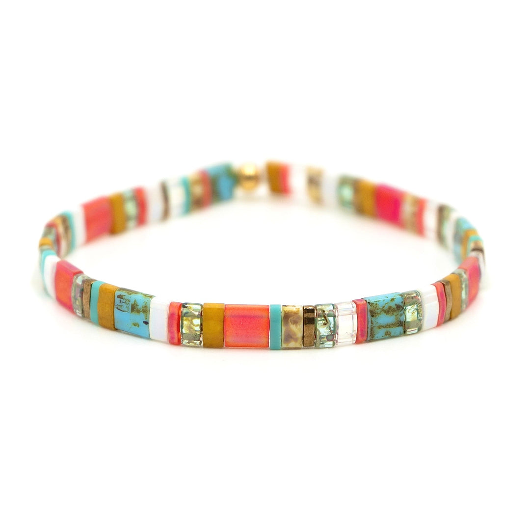 a bracelet with multi colored beads on a white background