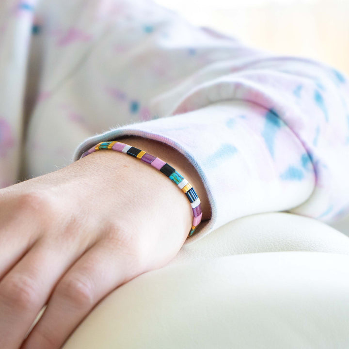 a close up of a person wearing a bracelet