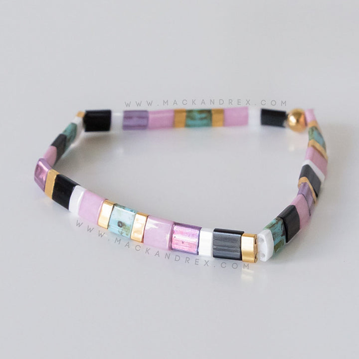 a close up of a bracelet on a table