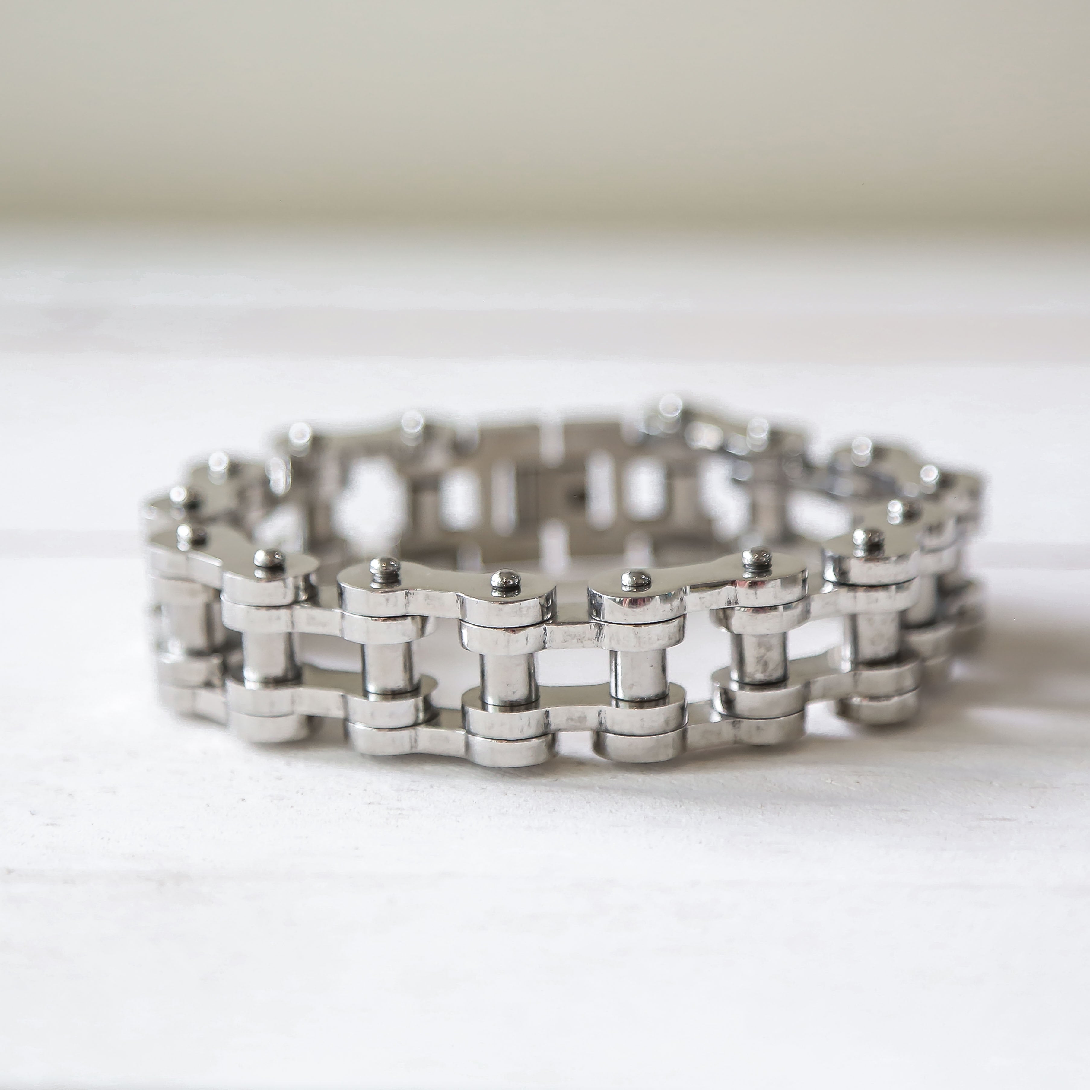 a close up of a metal bracelet on a table