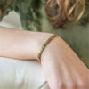 a close up of a person wearing a bracelet
