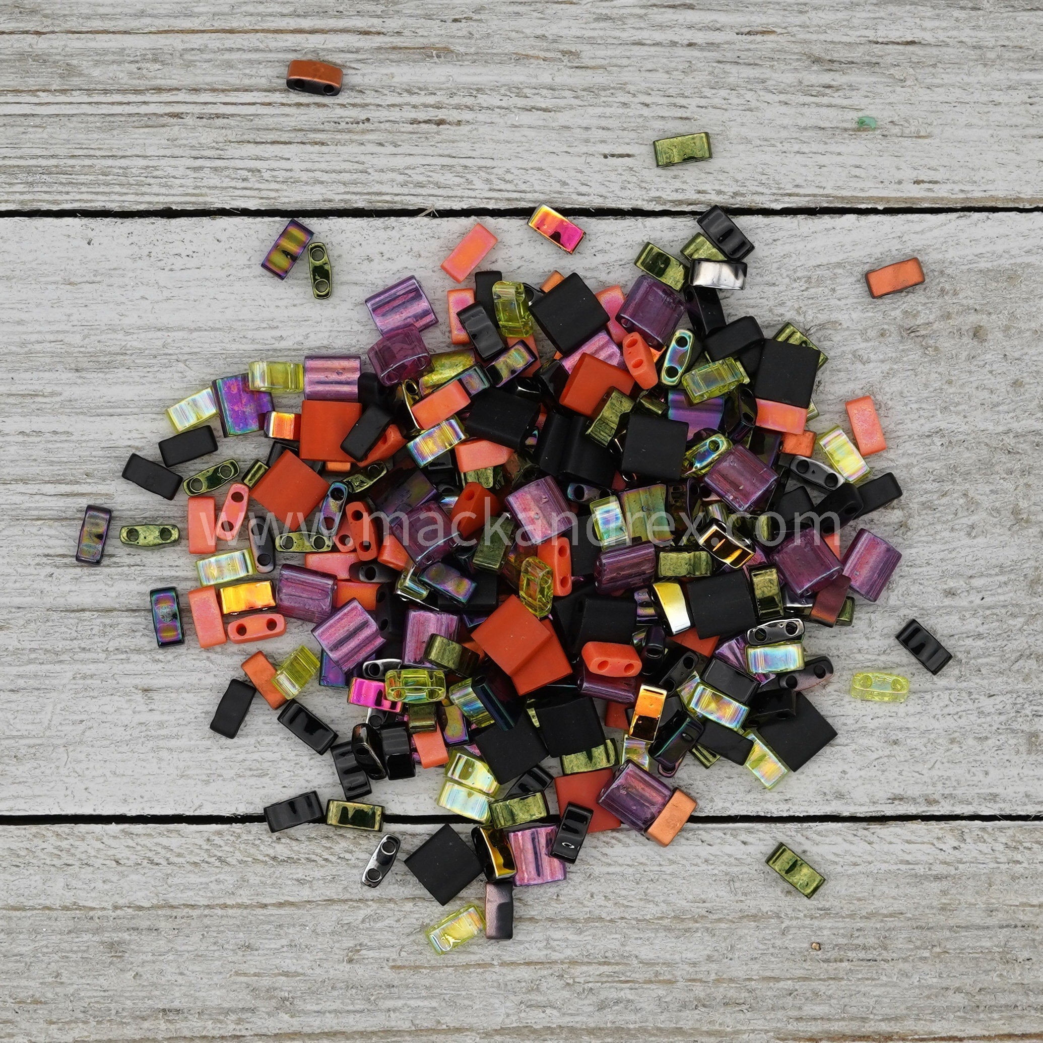 a pile of assorted colored beads on a table
