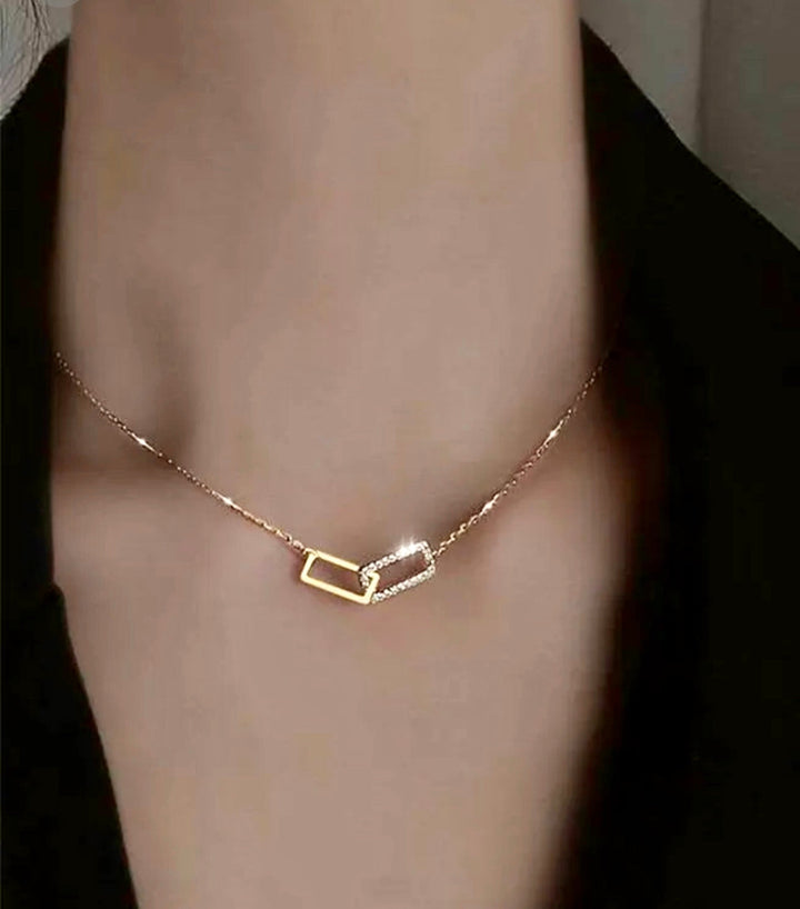 a close up of a person wearing a necklace
