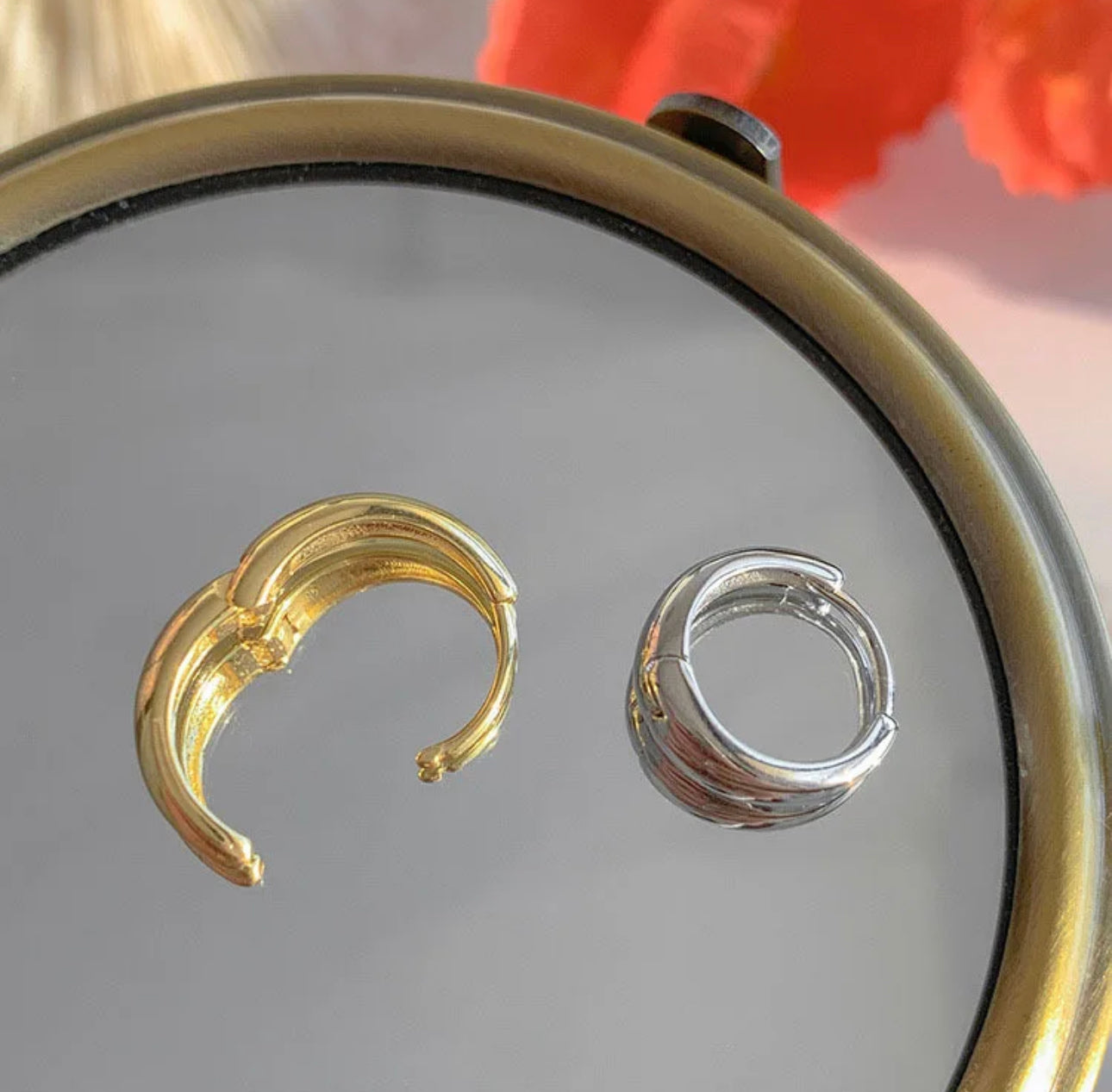 a close up of two rings on a table