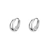 a pair of silver hoop earrings on a white background
