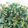 a pile of green and yellow glass beads