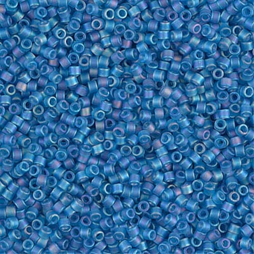 a bunch of blue beads on a white background