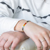 a person wearing a bracelet on their wrist