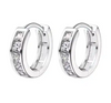 a pair of white gold hoop earrings with princess cut diamonds