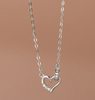 a necklace with a heart on a chain