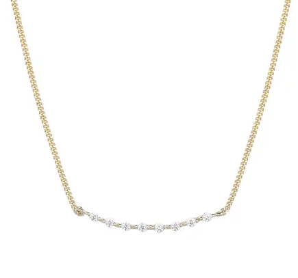 a gold chain necklace with five diamonds on it