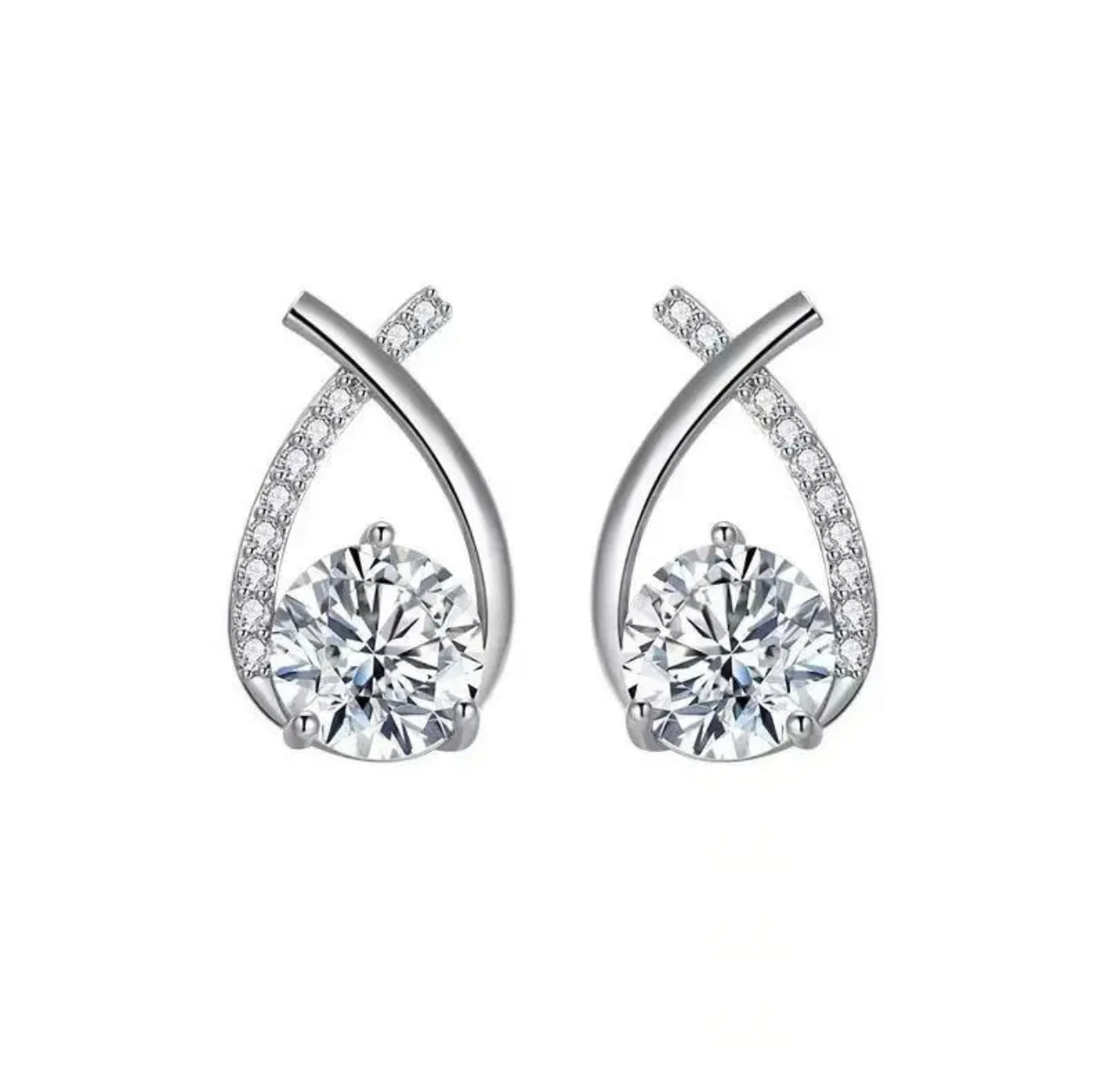 a pair of white gold earrings with diamonds