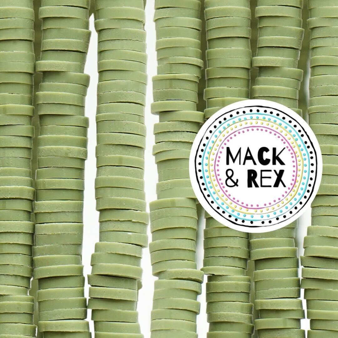 a pile of green macaroni and cheese crackers