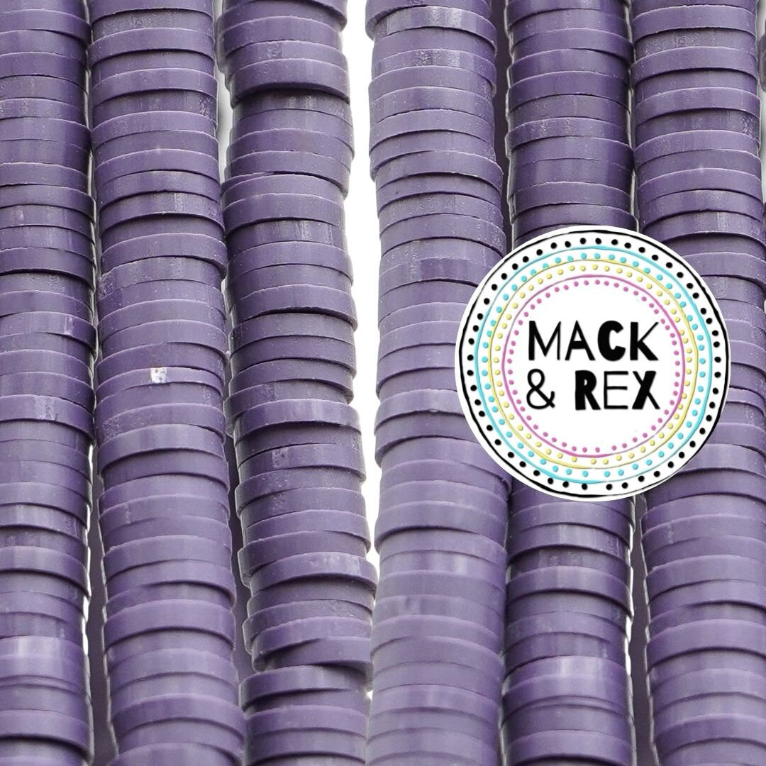 a pile of purple cups sitting next to each other