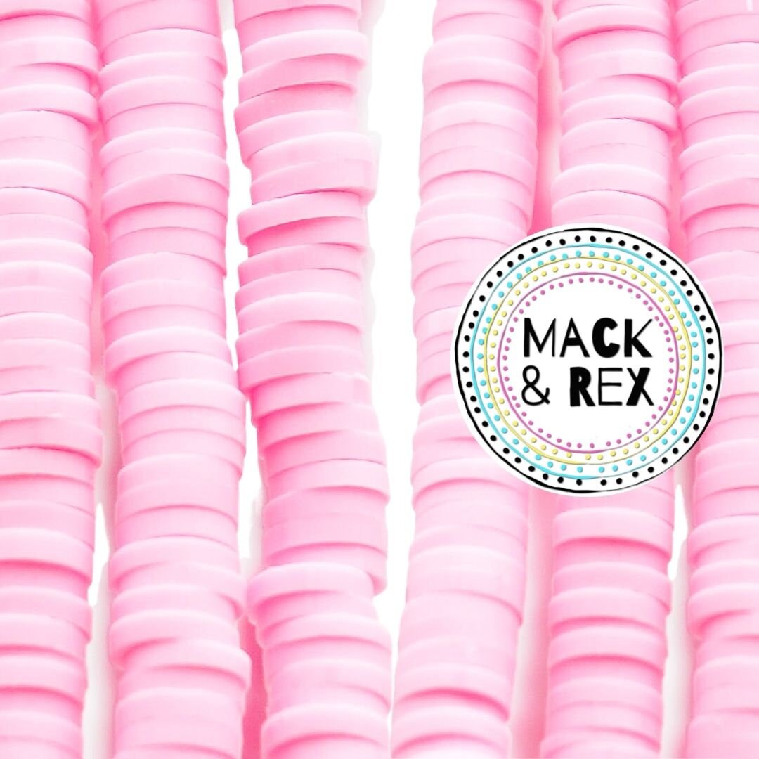 a pile of pink plastic cups sitting next to each other