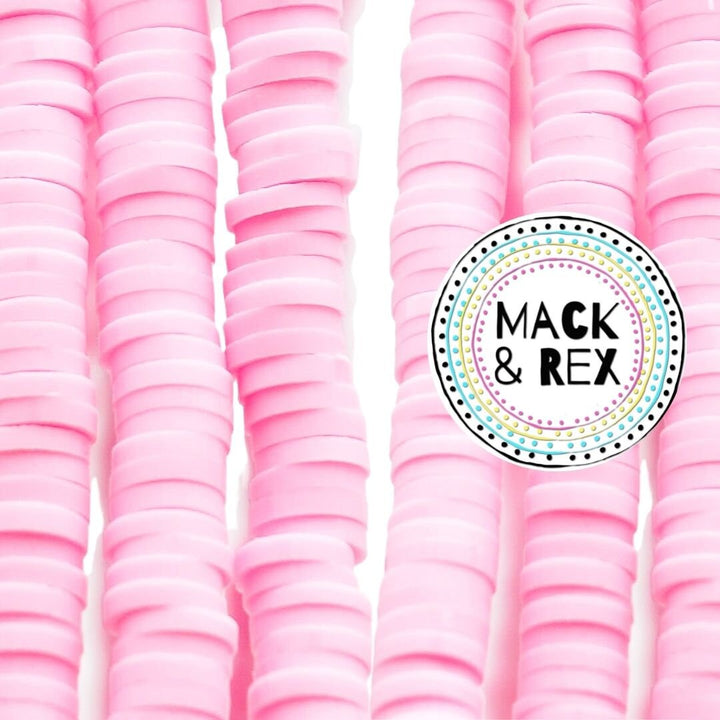 a pile of pink plastic cups sitting next to each other