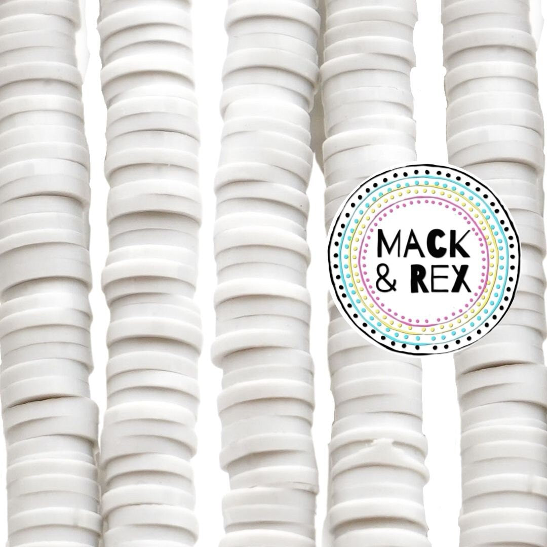 a bunch of white plates stacked on top of each other