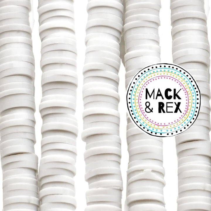a bunch of white plates stacked on top of each other
