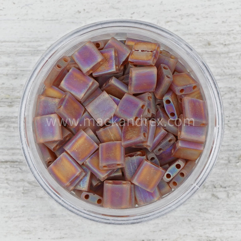 a bowl filled with lots of purple beads