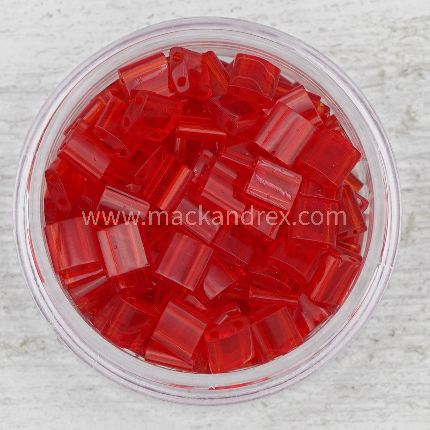 a bowl filled with red glass beads