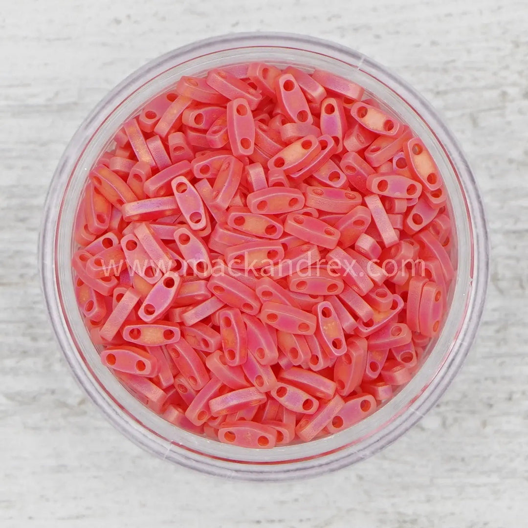 a bowl filled with pink colored plastic clips