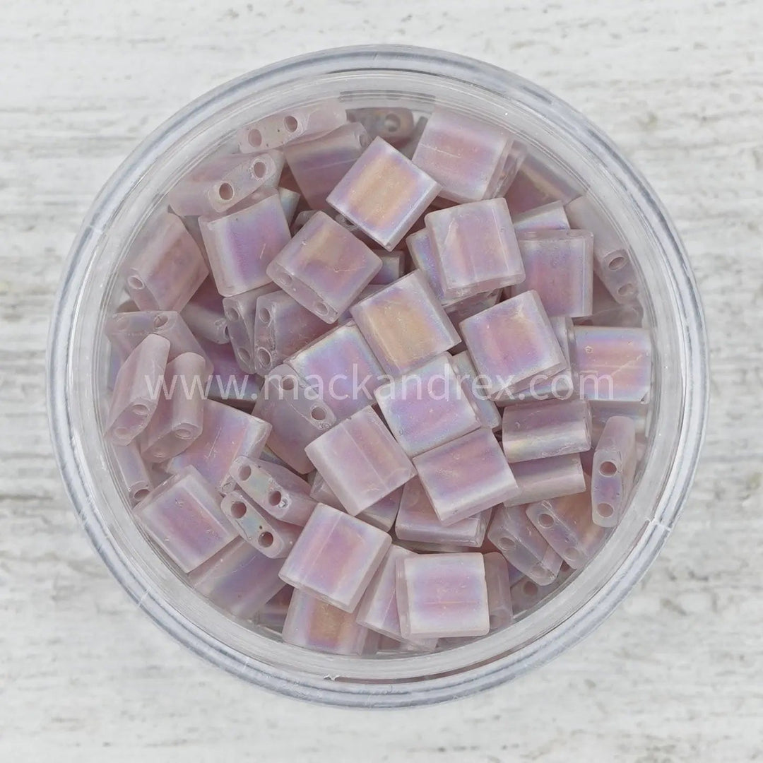 a bowl filled with lots of purple beads