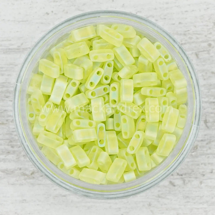 a bowl filled with yellow plastic beads