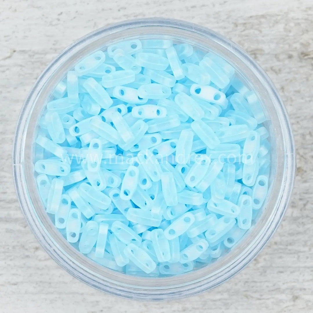 a bowl filled with lots of blue plastic beads