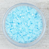 Load image into Gallery viewer, a bowl filled with blue plastic beads on top of a wooden table