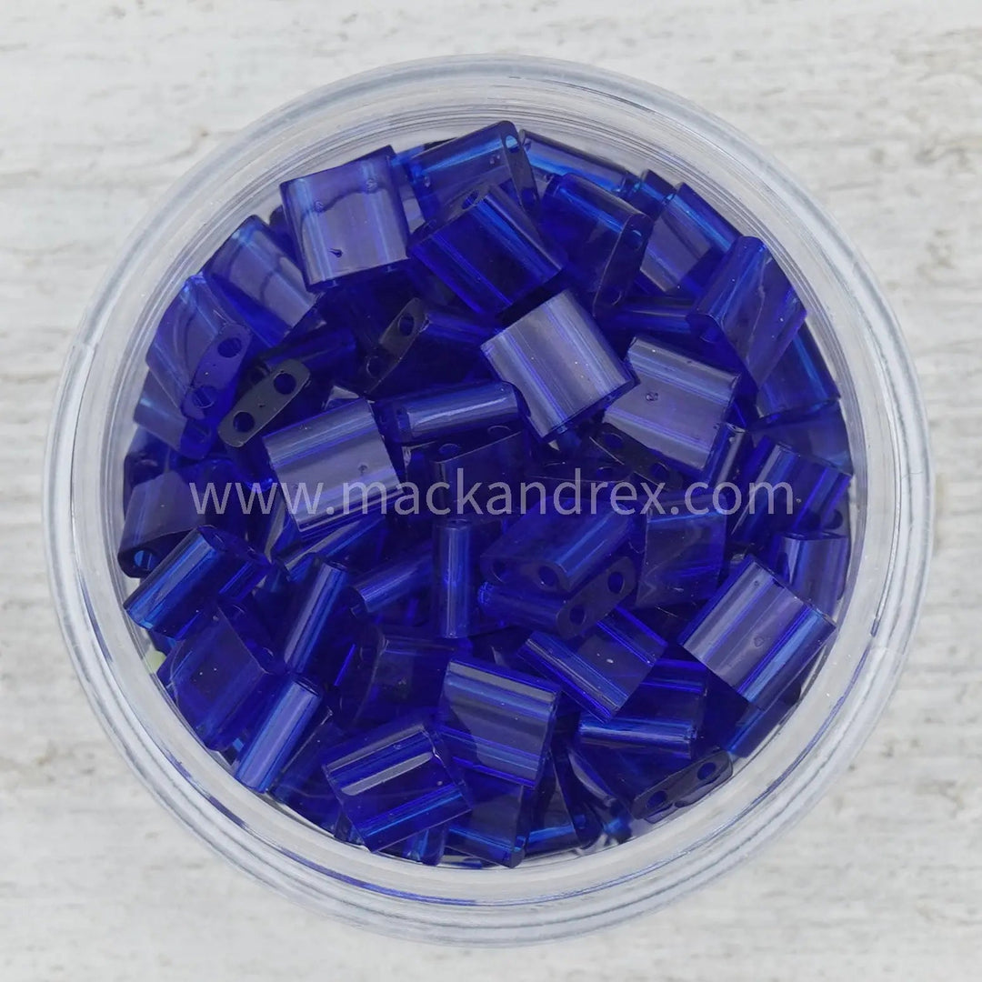 a bowl filled with blue glass beads