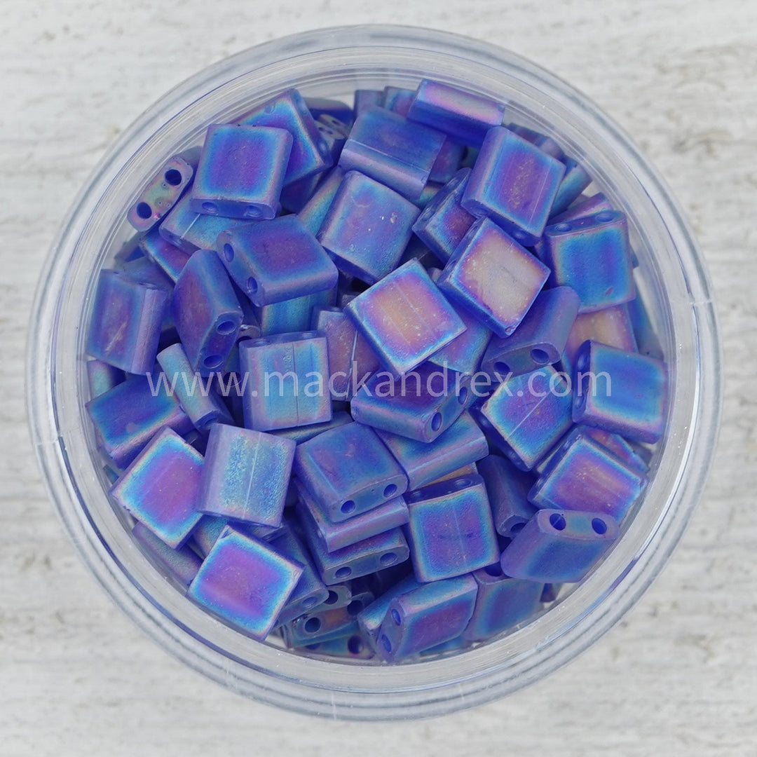 a bowl filled with blue and purple glass beads