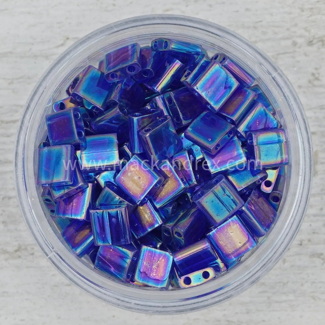 a bowl filled with blue and purple glass beads