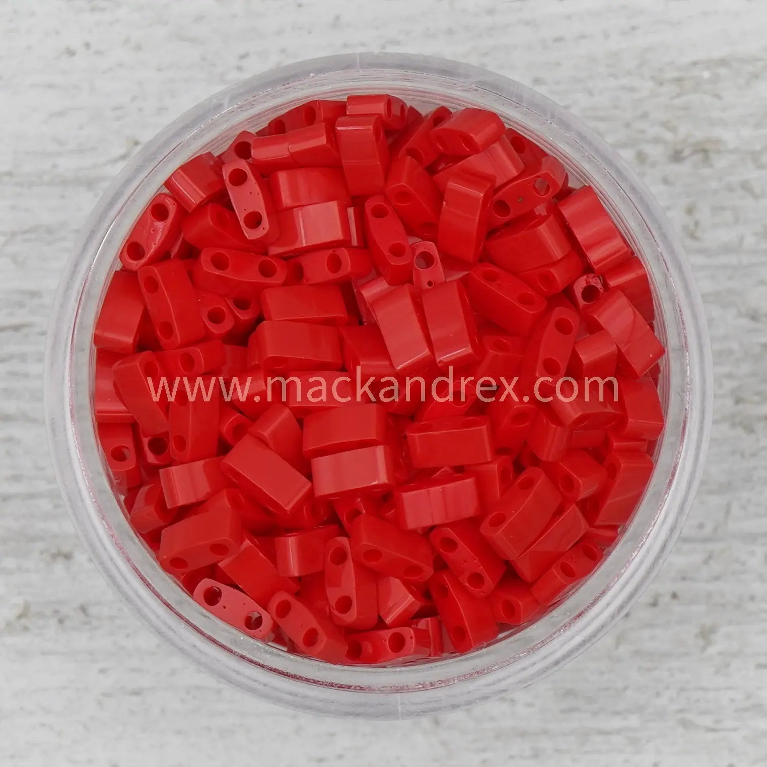a bowl filled with red plastic beads