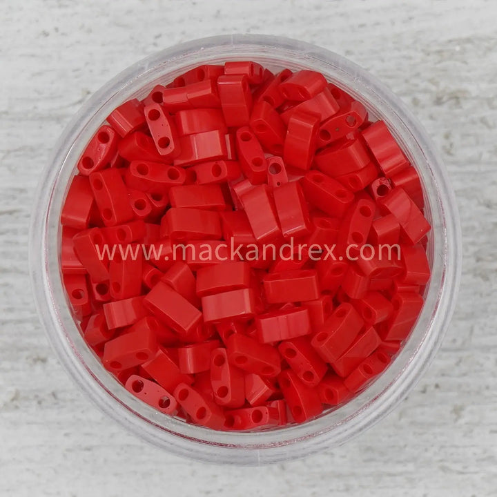 a bowl filled with red plastic beads