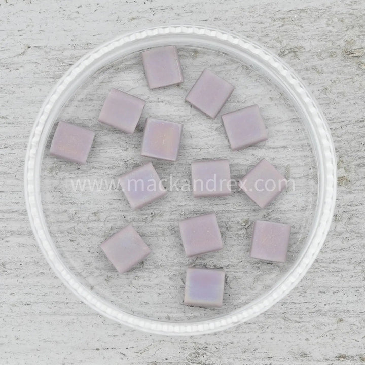 a white plate filled with lots of purple squares