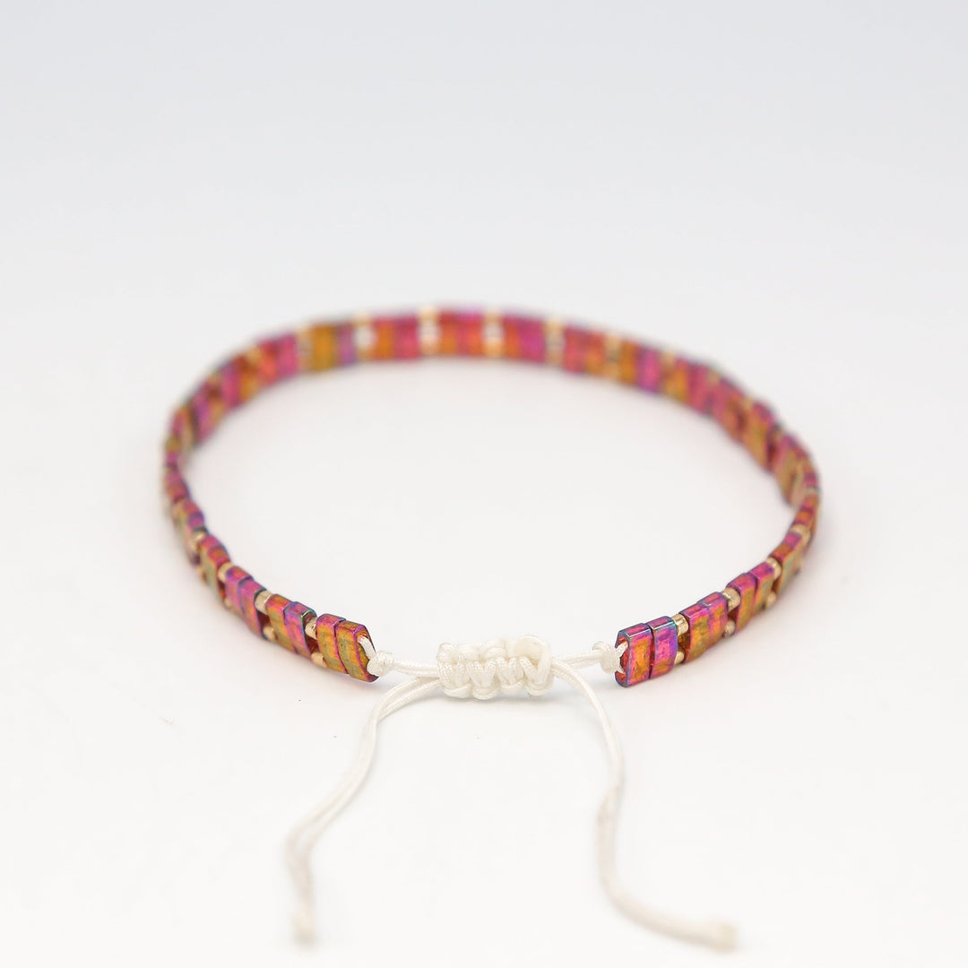 a bracelet with a knot on a white background