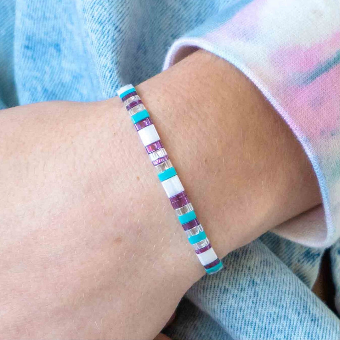 a close up of a person wearing a bracelet