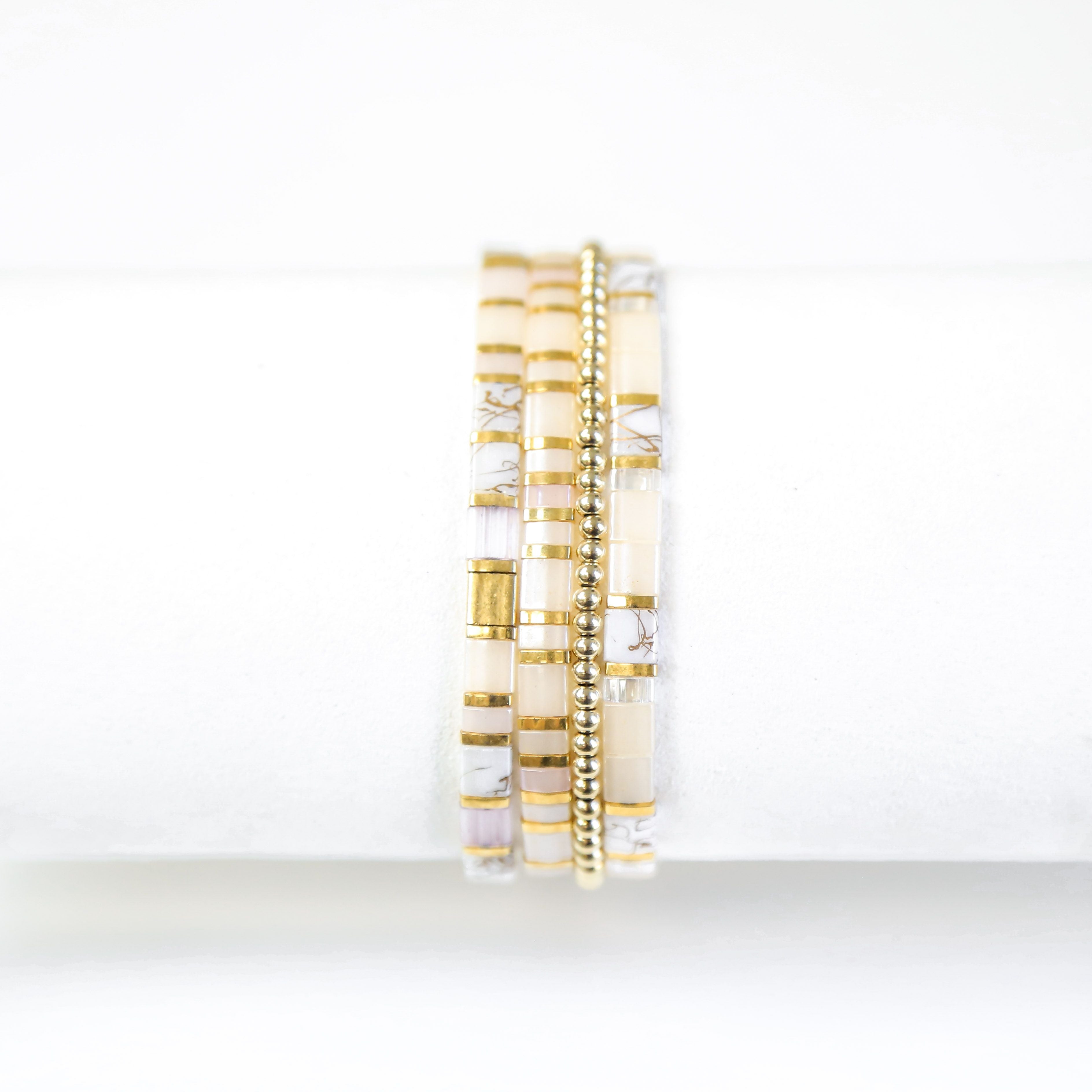 a close up of a stack of bracelets
