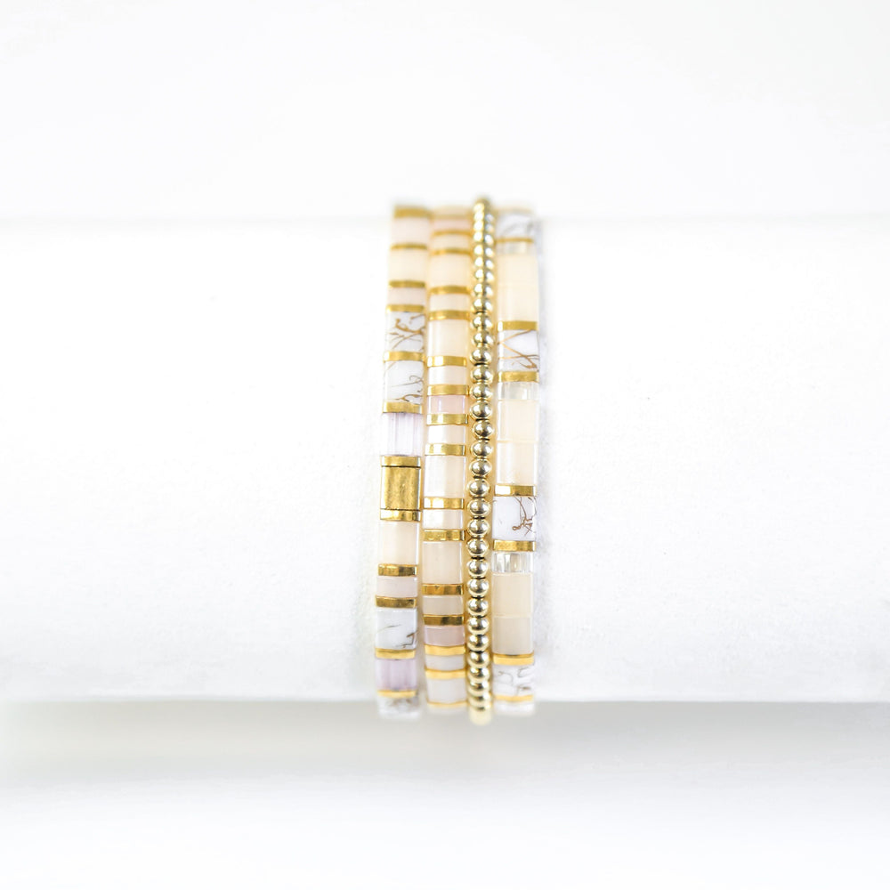a close up of a stack of bracelets