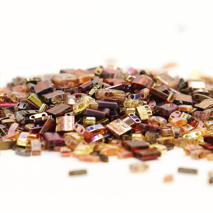 a pile of beads sitting on top of a white table