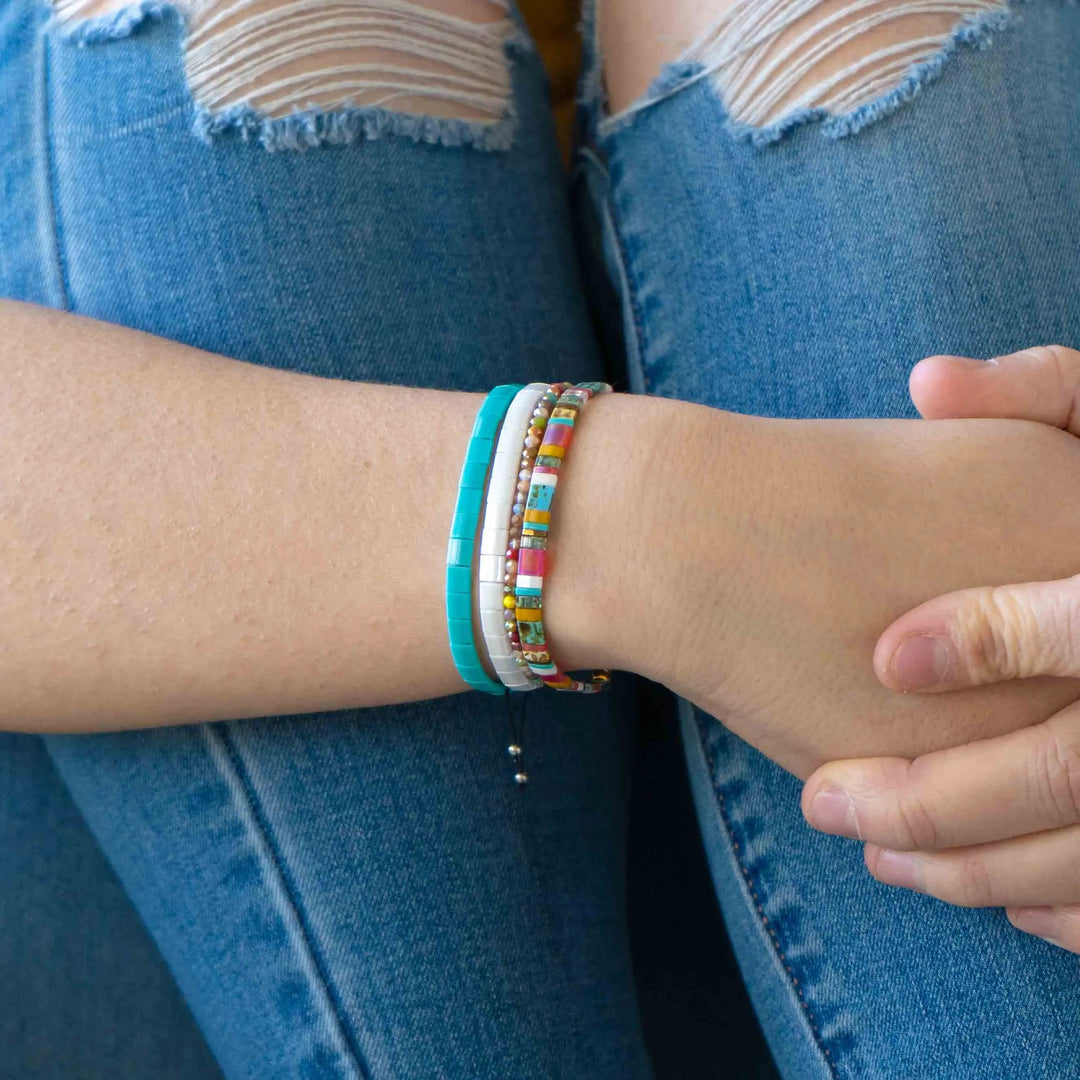 a close up of a person wearing a bracelet