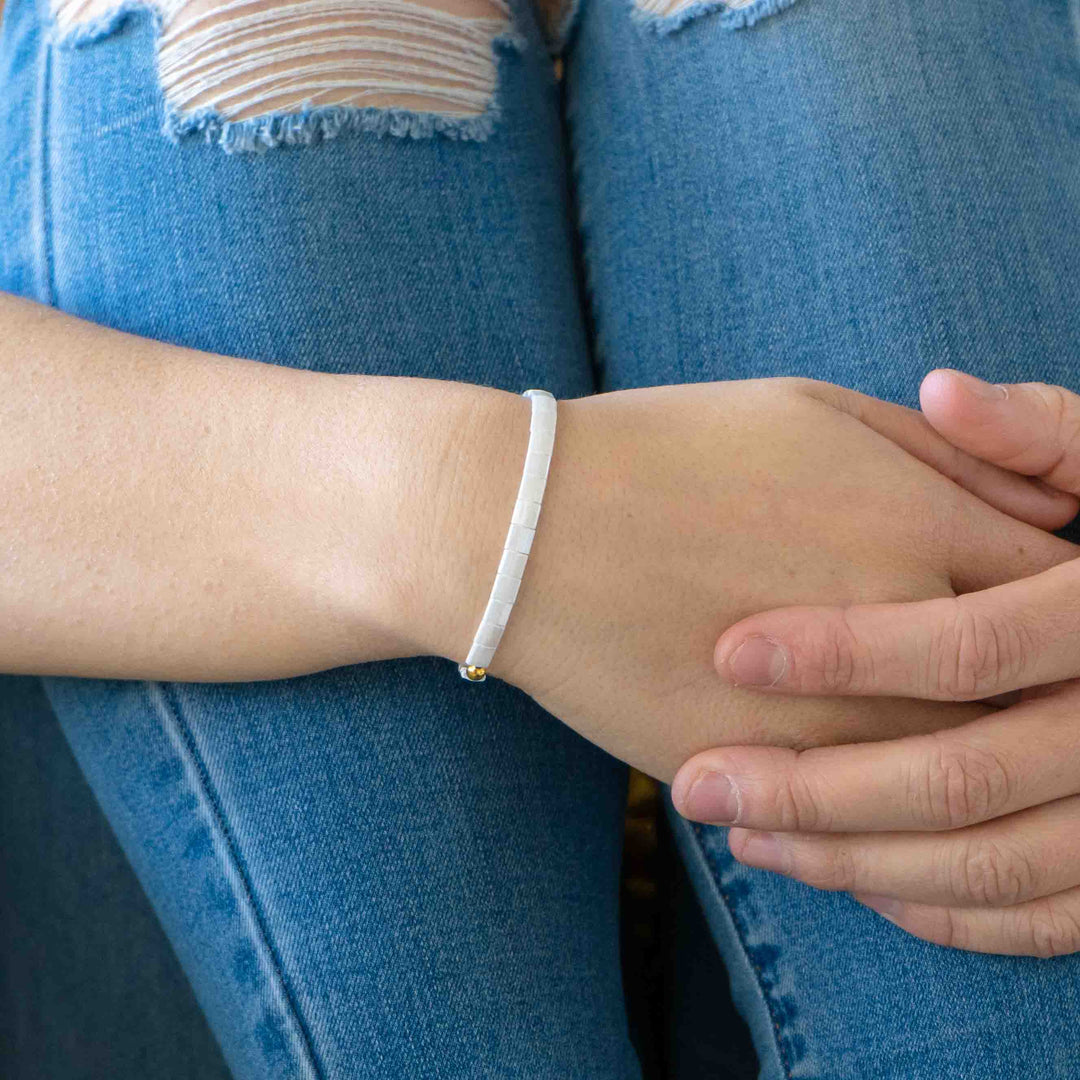 a close up of a person wearing a bracelet