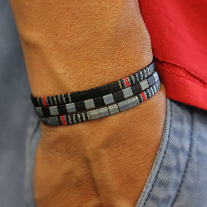 Backdraft set of bracelets on person's wrist