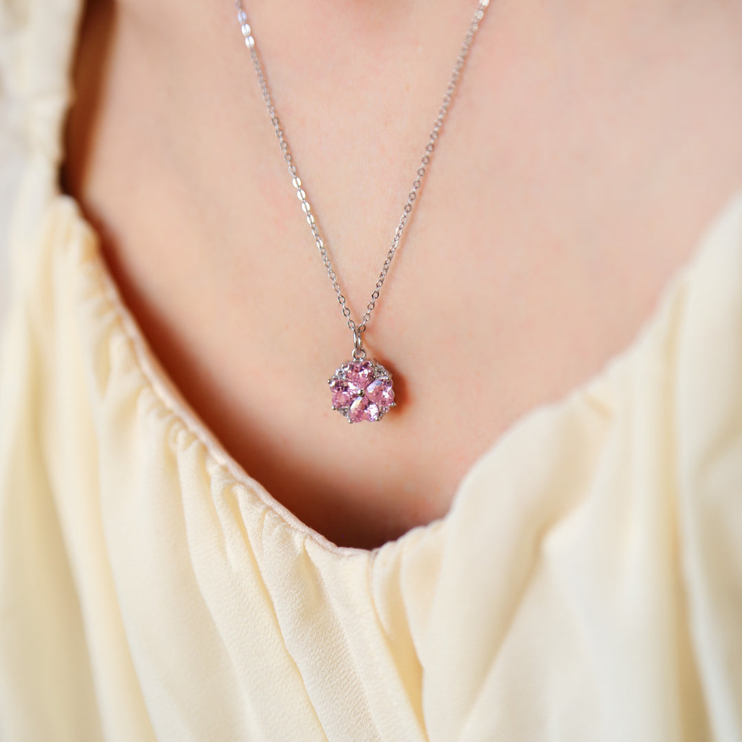 a close up of a person wearing a necklace