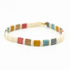 a bracelet with multicolored beads on a white background