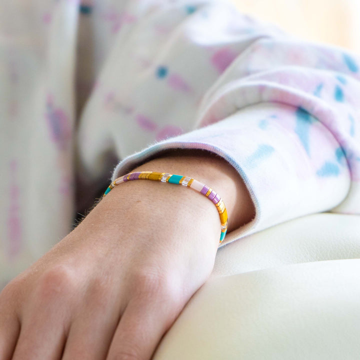 a close up of a person wearing a bracelet