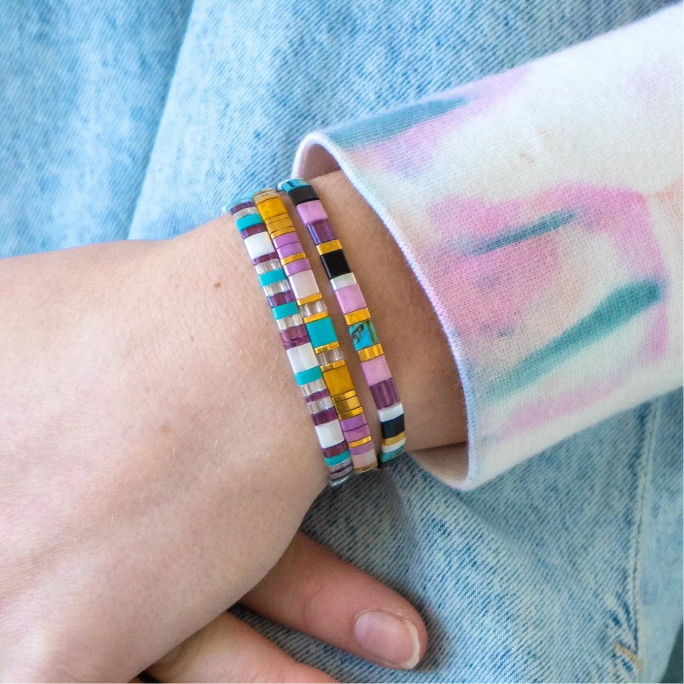 a close up of a person wearing a bracelet